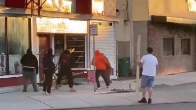 Shop keepers wife is beaten by looters in broad daylight