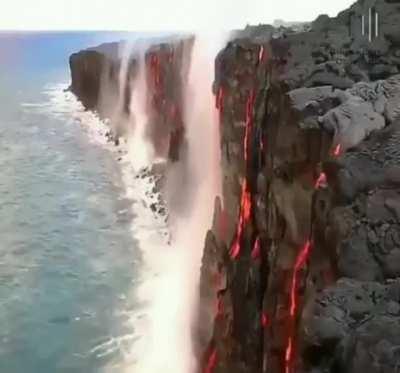 Seawater evaporating by lava resembles an inverted waterfall.