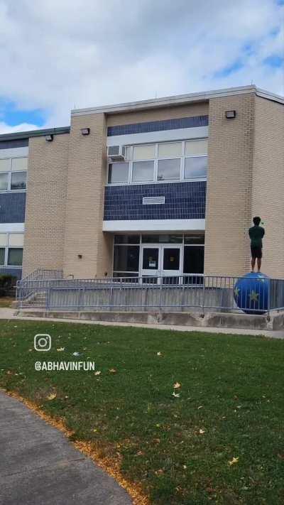 Walking up a ramp while juggling on a 48in walking globe!