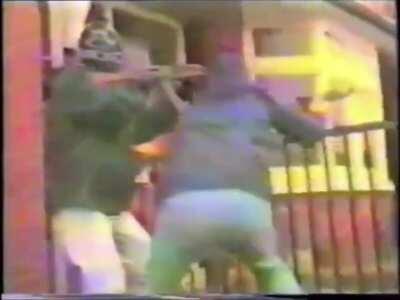 Members of the IRA firing at Loyalist gunmen (1980s, Northern Ireland).