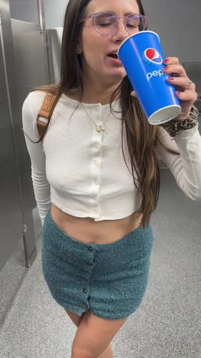 Grabbing a quick sip in the Costco bathroom