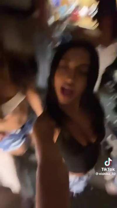 i think she’s wearing the top backwards 