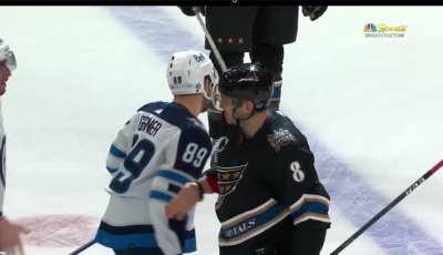 Jets lineup to shake Alexander Ovechkin's hand at center ice to congratulate him.