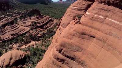 Bare mountain bike trail on the face of a cliff