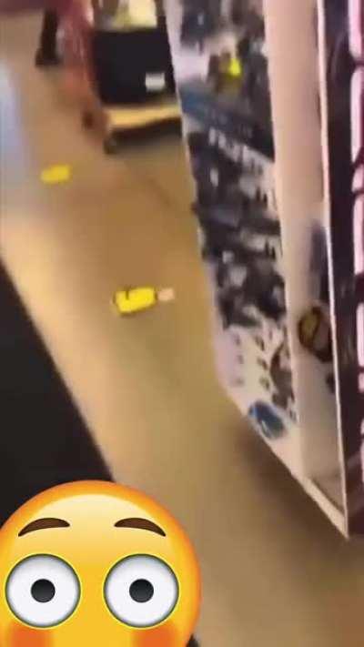 Violent woman gets shot by a store employee.