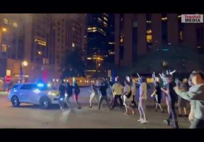 One last Chicago street takeover. Shooting fireworks at cops and pushing them back