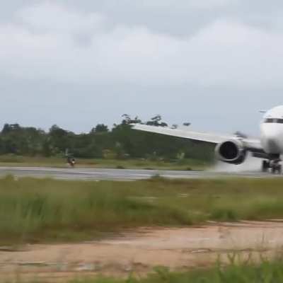 Batavia Air Boeing 737-300 landing at Domine Eduard Osok Airport with people close to the runway✈️. At this airport in Indonesia people are allowed to stay close to the runway and the only safety measure is an alarm that sounds when an aircraft is landing