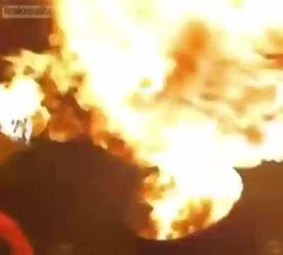 Man tries to spit inflammable liquid straight into fire and regrets