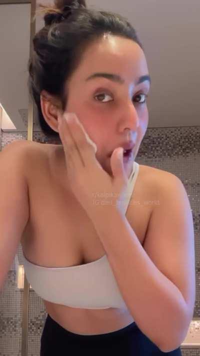 Neha Sharma deep cleavage, side boobs and armpits in face cleansing video