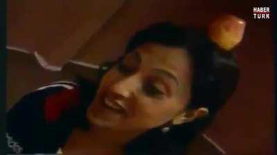 Turkish karate guy aims at the apple but instead kicks the living sh!t out of the unfortunate lady