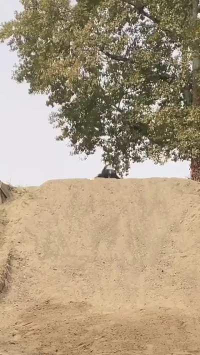 Richard Fert lands a triple backflip on dirt hill 