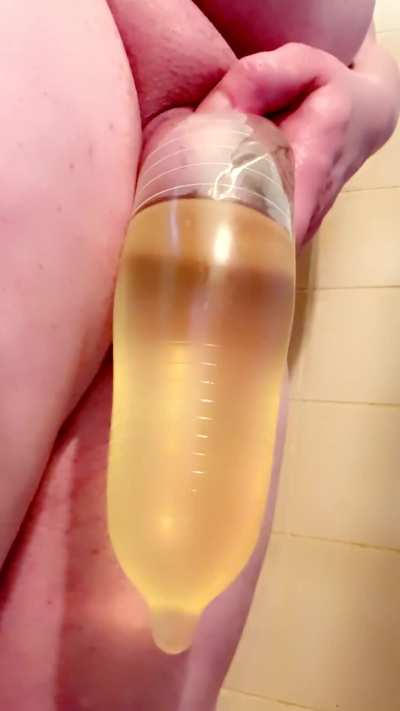 Just pissing into a condom I wrapped around my tiny girldick and balls