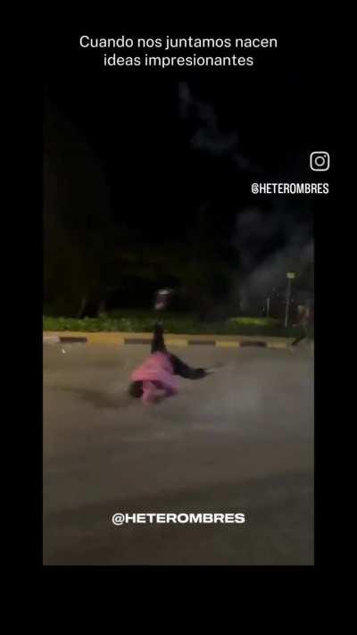 Guy dances with fireworks tied to his feet