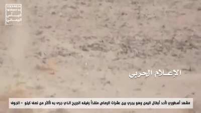 Yemeni man carrying someone while being shot at