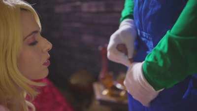 Princess Peach blows Luigi in order to escape from Bowser's Castle