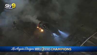 Guy does donuts over active fireworks, setting his car on fire