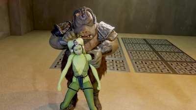 A helpless Han is forced to watch from the side as Jabba licks a topless Leia and has a Gamorrean guard prepare his second slave Oola (PN34)