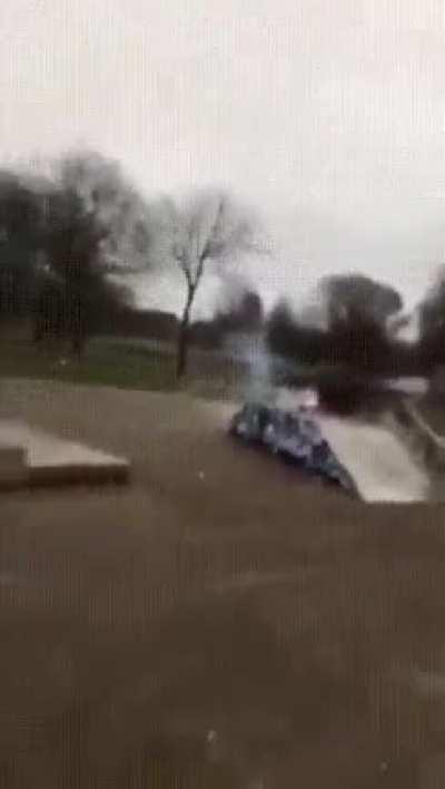 Surrounding a large firecracker in bottles of gasoline