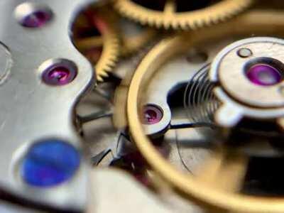 Watch balance+pallet fork meshing with escape wheel in ‘40s Pobeda wristwatch escapement