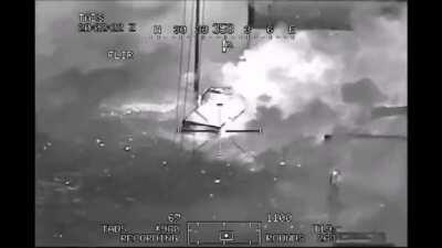 Direct hit on a group of Taliban fighters. A AH-64 Apache fires a AGM-114 Hellfire missile plus a little extra.