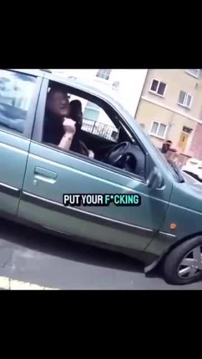 Cyclist and a car driver get into a heated argument.