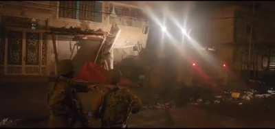 A shop in Hawara posted a pizza on Facebook with a picture of one of the abductees in Gaza First, Israelis tried to set fire to it. Then an IDF bulldozer came to finish the job.