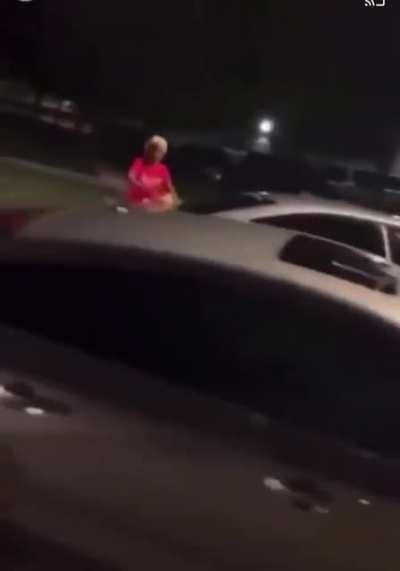 Woman pulls out a gun and let's shots off at a car during an argument 😲