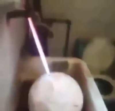 Filling a football with gas and lightning the escaping gas