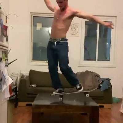 This skateboarder doing flawless tricks on a coffee table without falling.