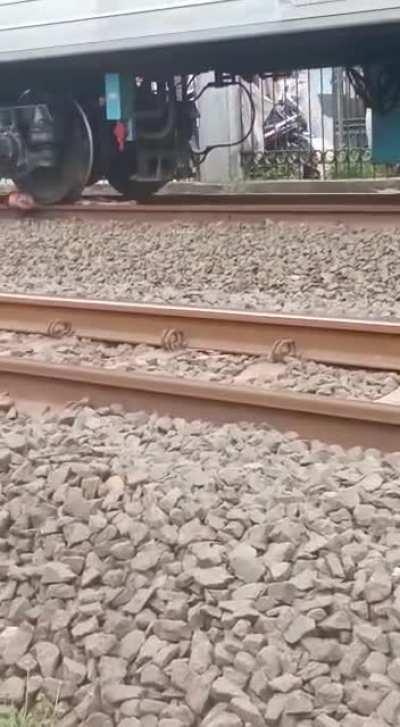 Lady ran over by train, being dragged by the neck