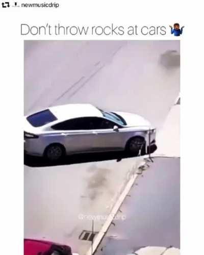 Man throws rock on a car and get ran up