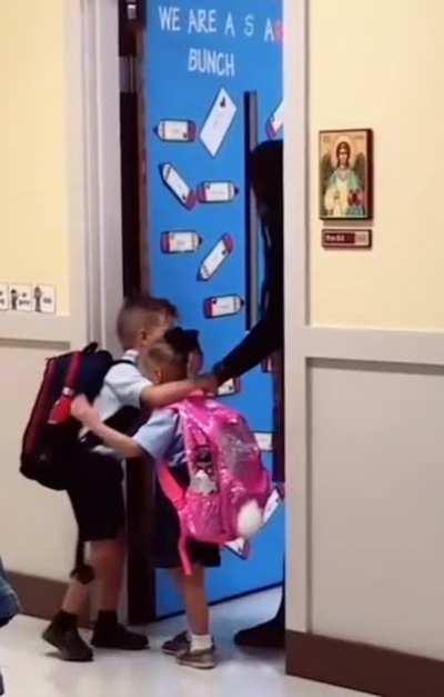 big brother comforting his nervous younger sister on their first day of class. I'm not crying you're crying 😭