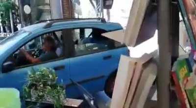 Woman trying to charge against the inside of a local store