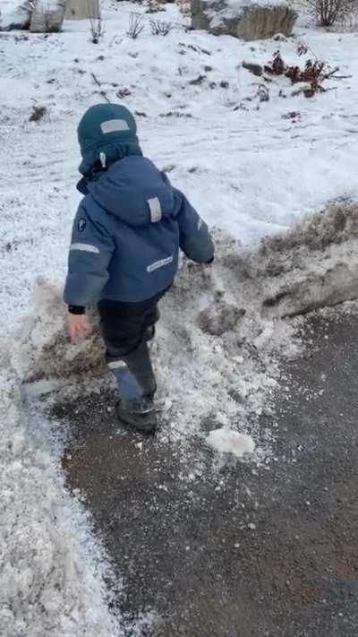 There’s a lot of ice throwing on this sub, but is there a more simple and fun activity than casually kicking a snow pile? My little guy being a dude