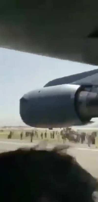 SFW: Selfie Angle - The last moments of men clinging to some parts of the C-17 yesterday
