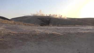 Iraqi cameramen capture a frantic battle with IS fighters in which gunship support is used danger close - Hawija, Iraq - 2018