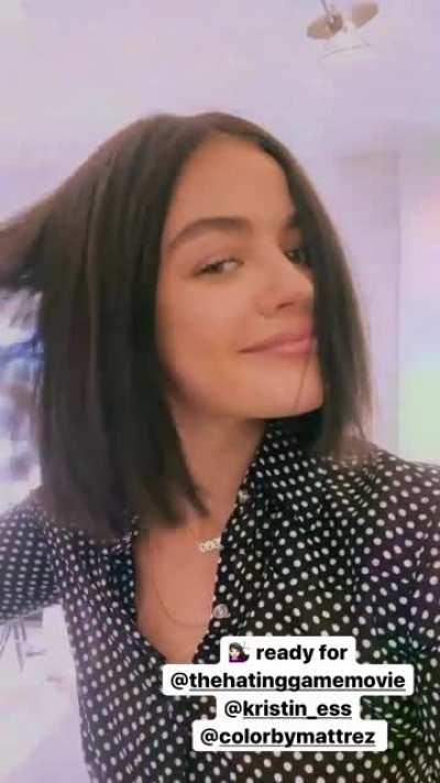 Playing with her hair