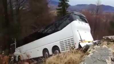 Bus driver loses control of bus while trying to get unstuck