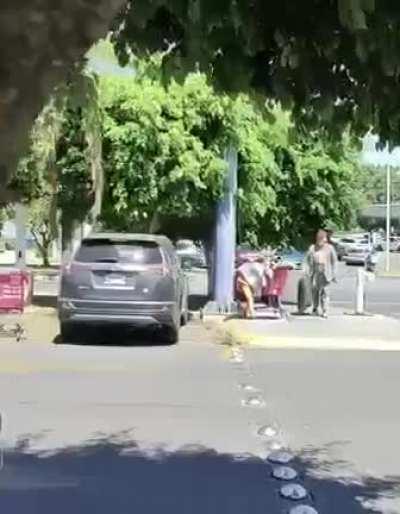 Man sneaks a whole lot of groceries into an old homeless man cart. Doesn't say anything...