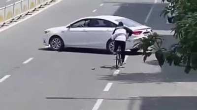 WCGW cycling with hands in pockets.