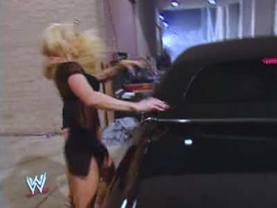Stephanie McMahon ripping Sable's top off.