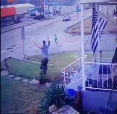 A young man saves a neighborhood kid from walking into traffic