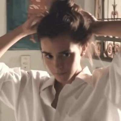 Emma Watson putting her hair up for a fun time