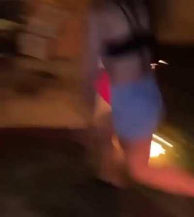 Girls trying to start a bonfire