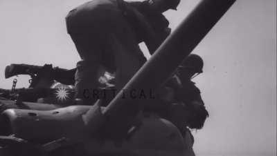 French tank crew removing body of dead soldier from tank (August 1944)