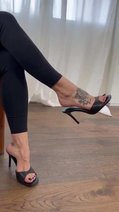 Black high heel mules are a foot fetishist's dream! 😍