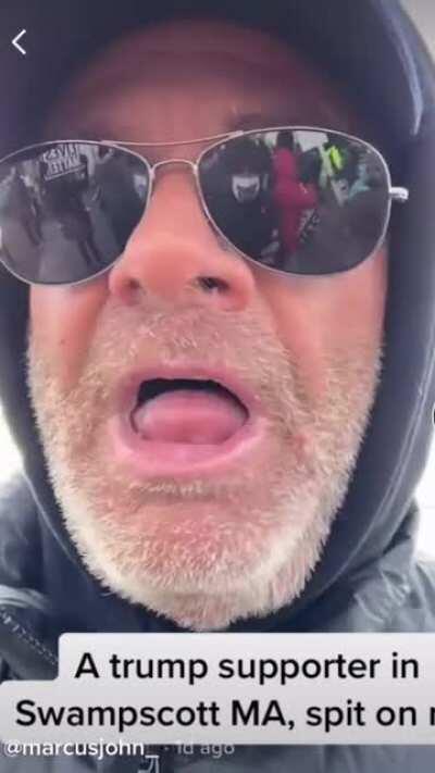 Trump supporter gets angry and starts coughing and spitting at two women he is arguing with