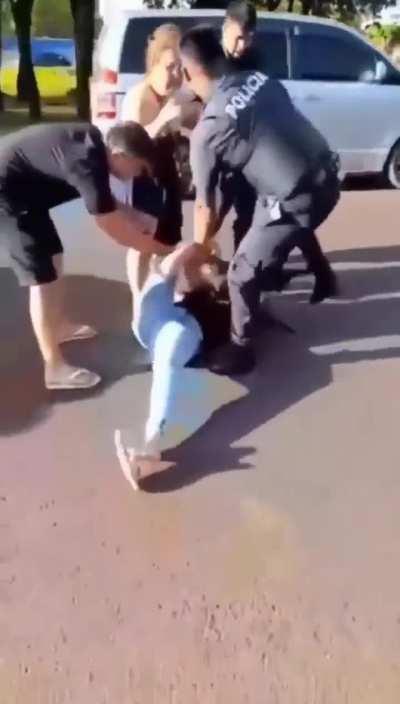 Crazy women hitting a police officer