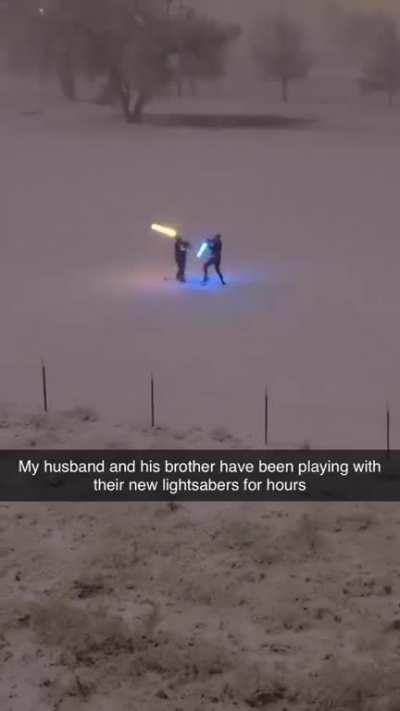 You're never too old to have a lightsaber fight with your brother in the snow.