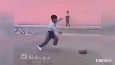 Kid kicks rock, doesn't understand inertia.